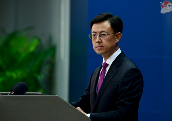 龙信金融 一名美国政府雇员被禁止离开中国？中方回应